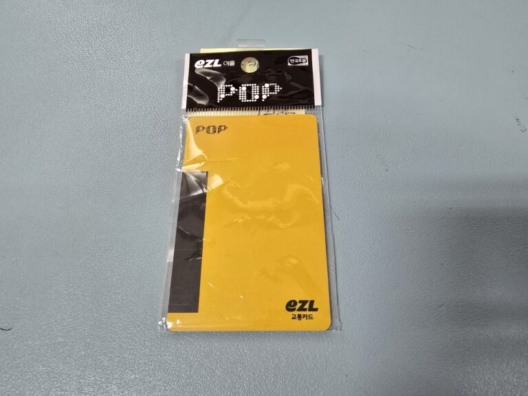 Yellow POP EZL transit card in its packaging.